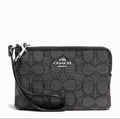 Coach corner zip wristlet in signature fabric